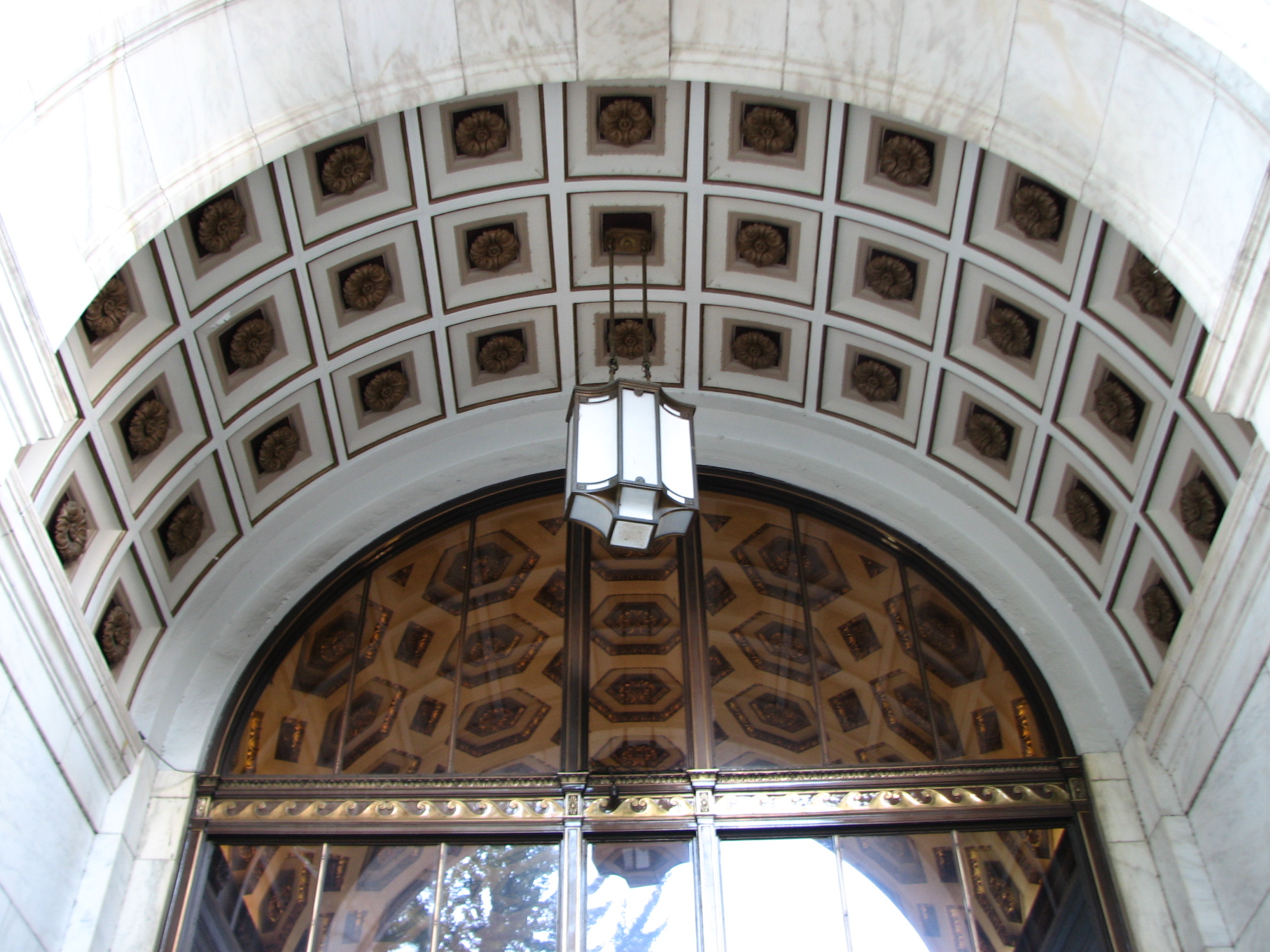 Coffered ceilings adorn the exterior arches and interior ceiling of the 6th Street entrance.