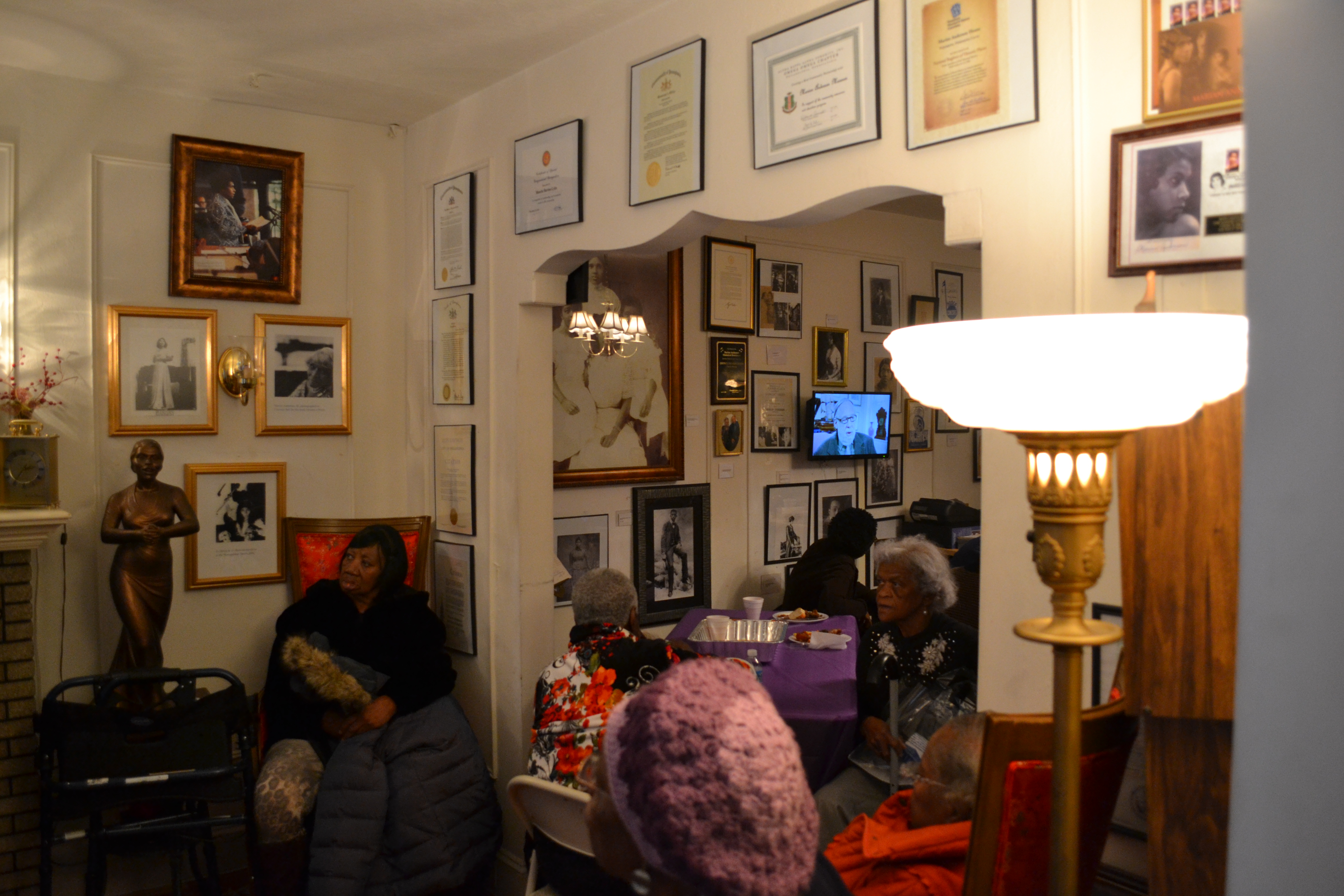 Photos, plaques and certificates line the wall of Anderson's home, now the Marian Anderson Residence Museum