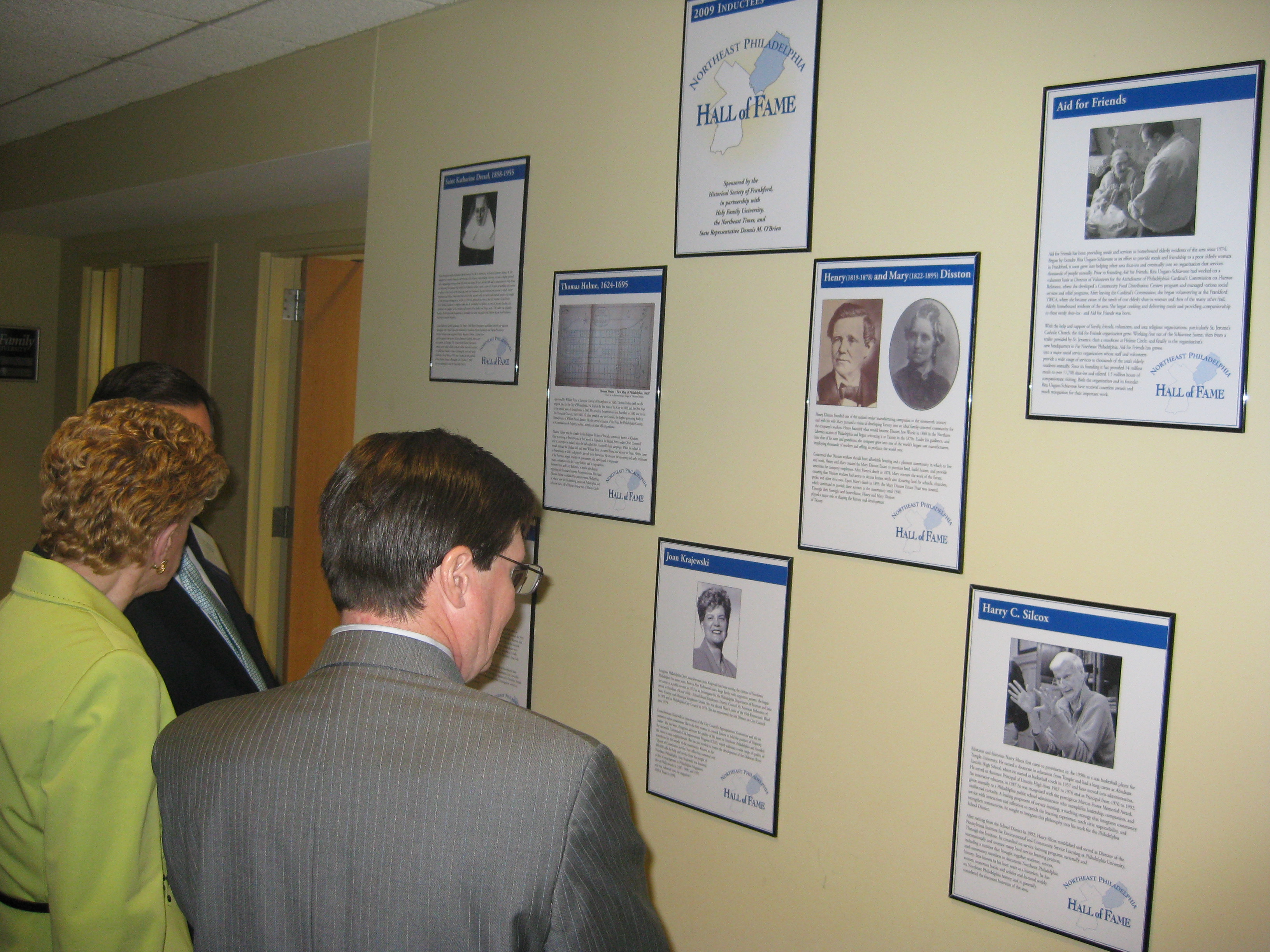 City Councilwoman Joan Krajewski (l) examines the wall of inductees to the Northeast Philadelphia Hall of Fame. Photo by Christopher Wink.