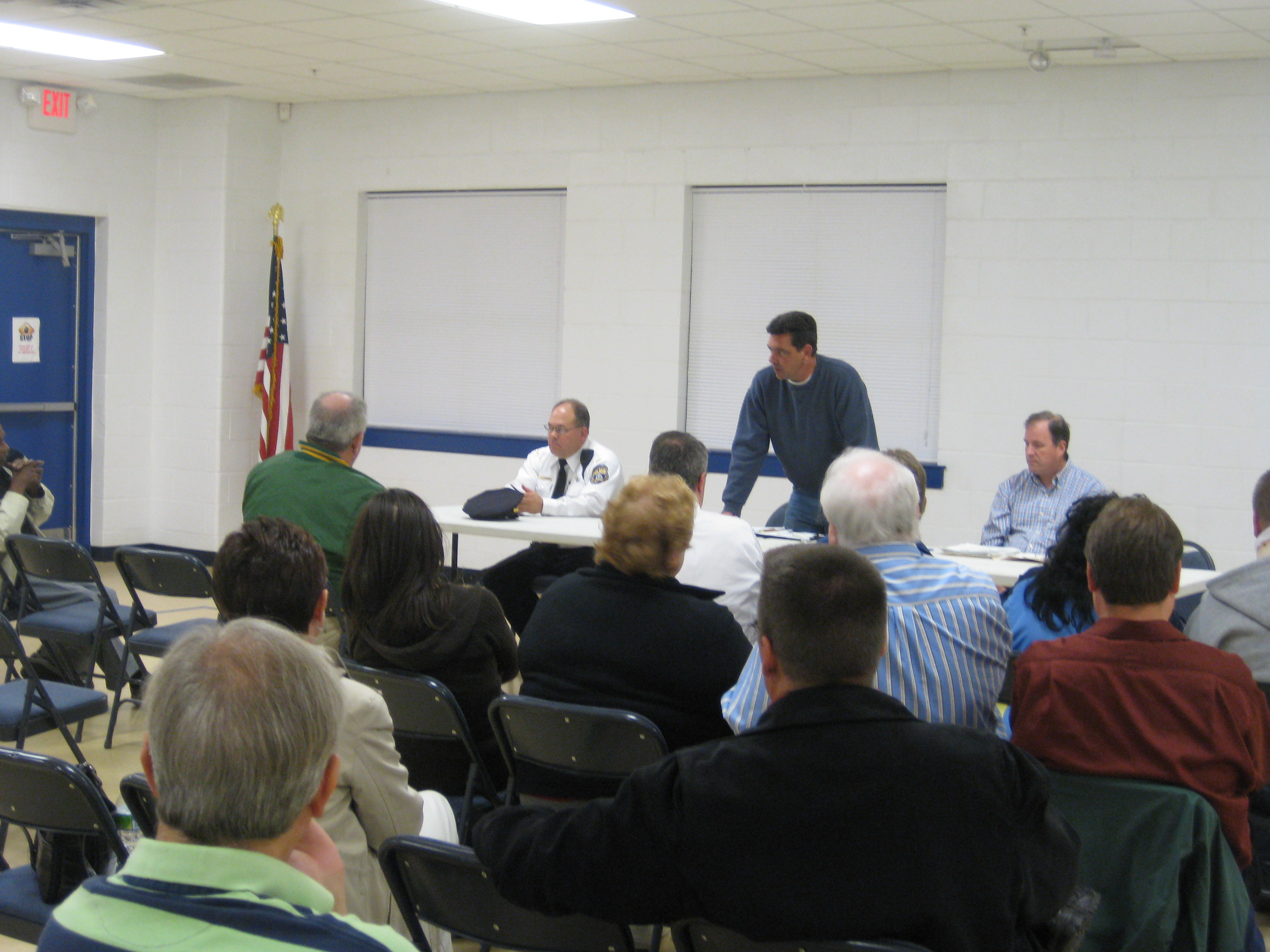 Mayfair Town Watch president John Vearling (center) takes suggestions from members of the newly formed group.