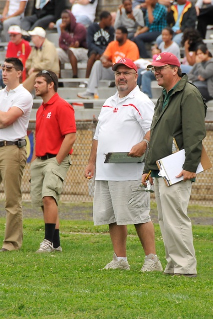 Mike Ferris (left foreground) catches up with Ted Silary (right foreground) at a North game. Photo by Bill Achuff.