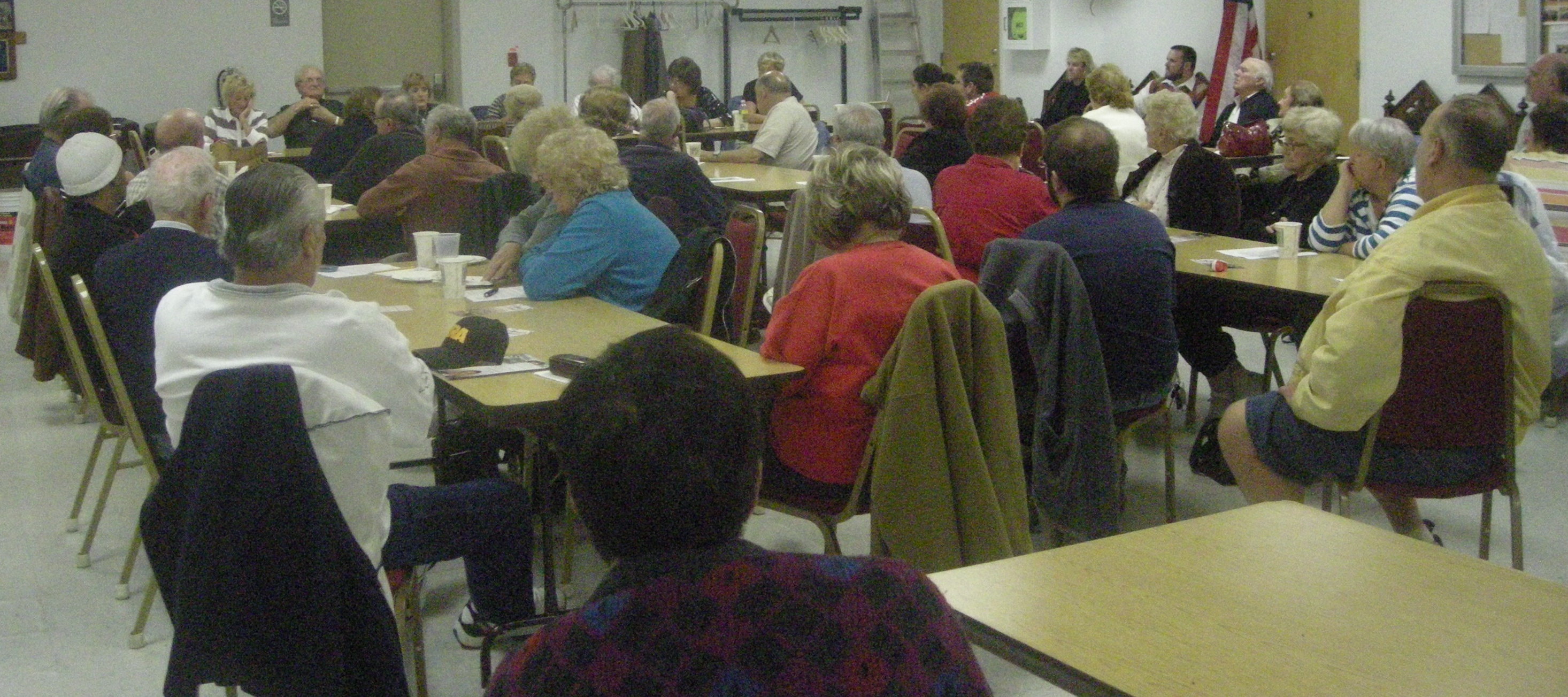Somerton Civic Association board members present last month's minutes to the attendees.