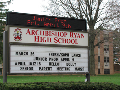 Archbishop Ryan High School's front-lawn marquee boasts news of the junior prom and student productions.