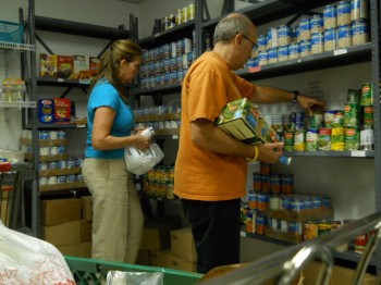 Norman and Colleen Millan help to fill the pantry at the Klein JCC in Northeast Philadelphia. Photo by Tom Rowan Jr.