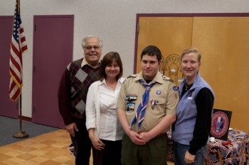 Eagle Scout Andrew Stockette celebrates with (L to R) SPIN founder David Lossino, SPIN community affairs director Bernice McHale and his occupational therapist Beth Konde.