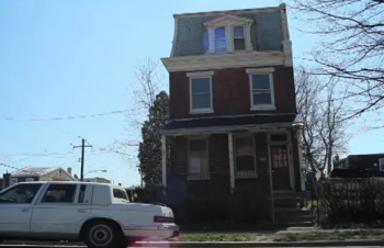 Vacant houses like the one across the street from 6th District Council candidate Sandy Stewart in Tacony prompt concerns about absentee landlords.
