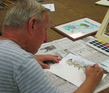 Artist Robert Obodzinsky painting a water color of The Basilica di S. Pietro