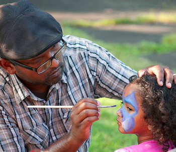 Face-painters drew long lines at the Seven Mile Road Church Community Bash. Photo by George Mai.