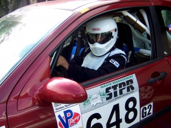 Anthony Concha behind the wheel of the car he uses for rally races. Photo by Pamela Seaton.