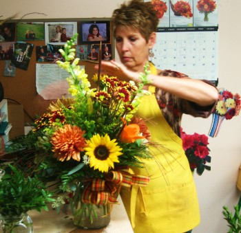 Karen Sperduto prepares an order at Sally's Flowers in Fox Chase. Photo by G.E. Reutter