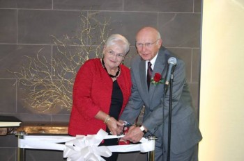 The Rev. James E. Tallman (right) and his wife Pat Tallman (left) cut the ribbon in The Rev. James E. Tallman Meditation Chapel at the Wesley Enhanced Living retirement community. Photo provided by We